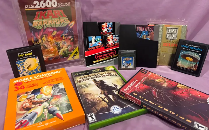 Atari 2600, NES, Game Boy, Xbox and PlayStation 2 games, including a graded Ikari Warriors and Missile Command